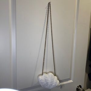 Trendy white shell purse. Wicker. Great condition. Blue satin lining